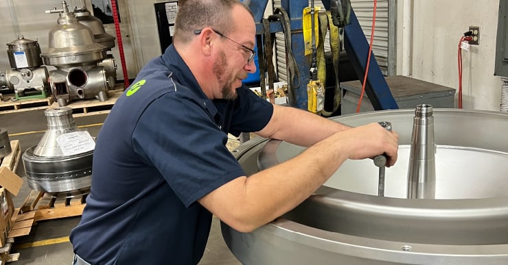 Separators technician working on a centrifuge